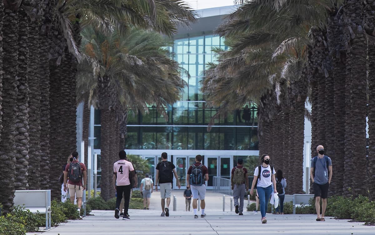 students walking on  campus