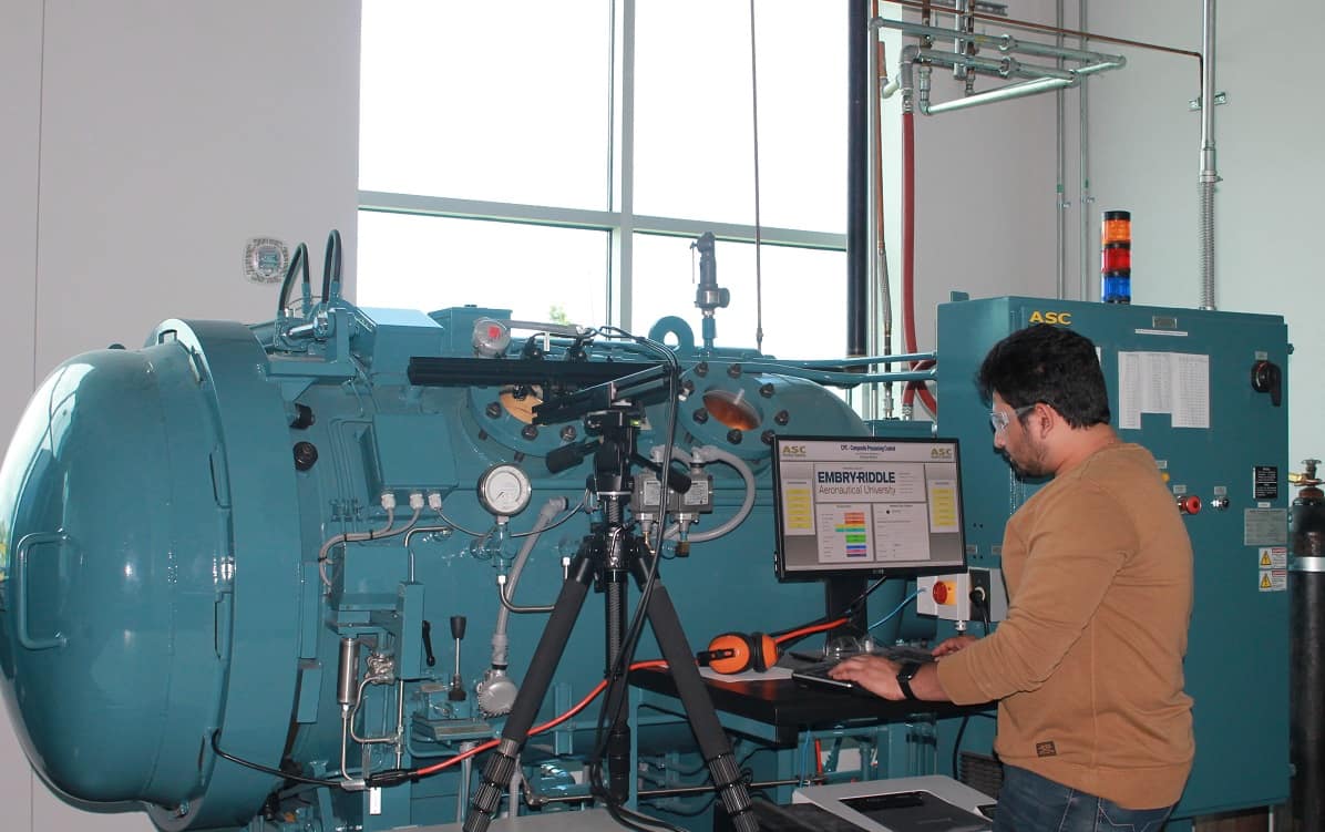 Doctoral student Sandeep Chava works on in situ characterization of composite processing, using the autoclave, located in Embry-Riddle’s John Mica Engineering and Aerospace Innovation Complex, or MicaPlex. (Photo: Samarth Motagi)