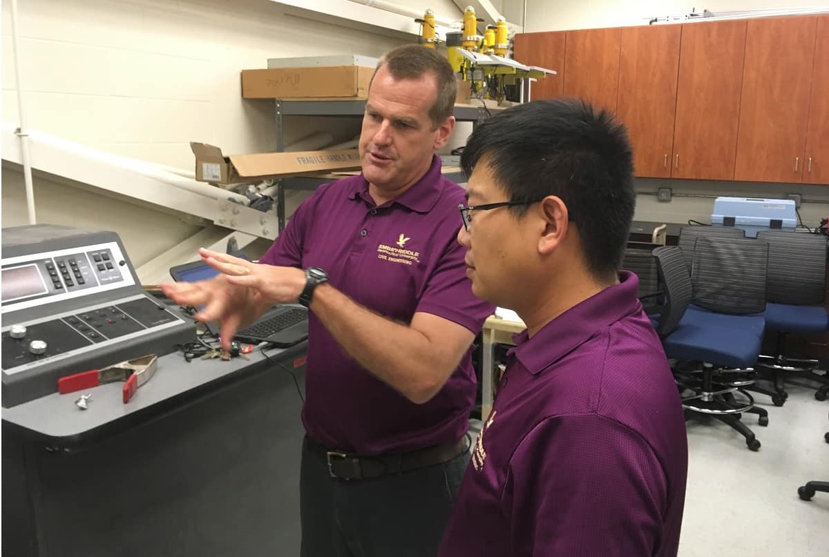 Associate professor of Civil Engineering Jeff Brown and assistant professor Dan Su discuss the testing of a reinforced concrete beam using distributed optical fiber sensors.