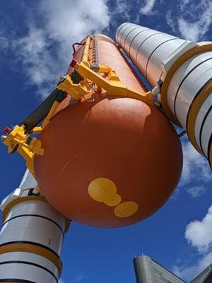 Vertical view of a rocket on a launch pad.