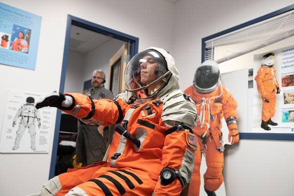 The Embry-Riddle S.U.I.T. (Spacesuit Utilization of Innovative Technology) Laboratory is used by Spaceflight Operations students like Chase Covello who, here, tests a spacesuit prior to pressurization.  (Photo: Embry-Riddle/David Massey) 