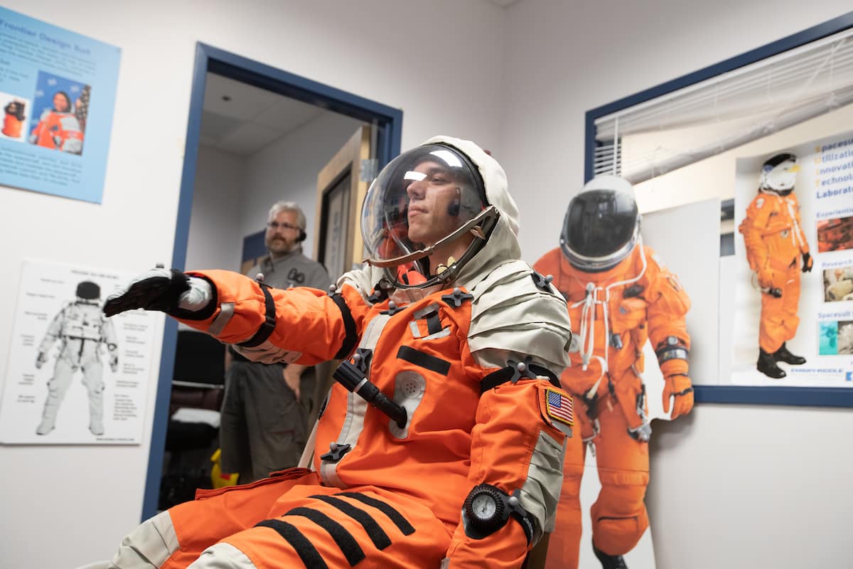 The Embry-Riddle S.U.I.T. (Spacesuit Utilization of Innovative Technology) Laboratory is used by Spaceflight Operations students like Chase Covello who, here, tests a spacesuit prior to pressurization. (Photo: Embry-Riddle/David Massey)