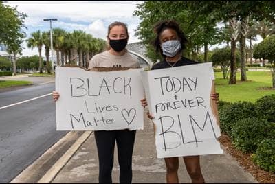 Two ERAU students protest.