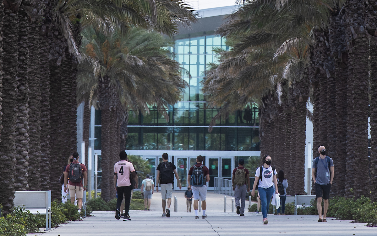 students on campus in masks