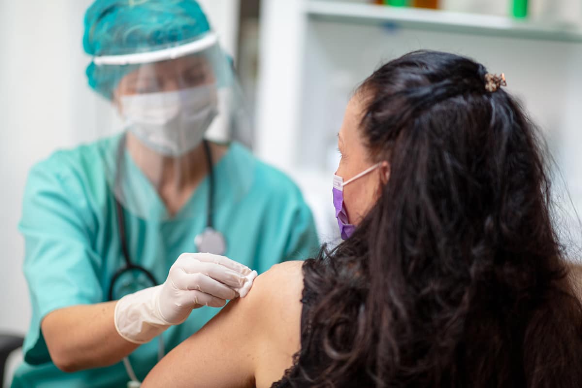 a woman gets a flu shot