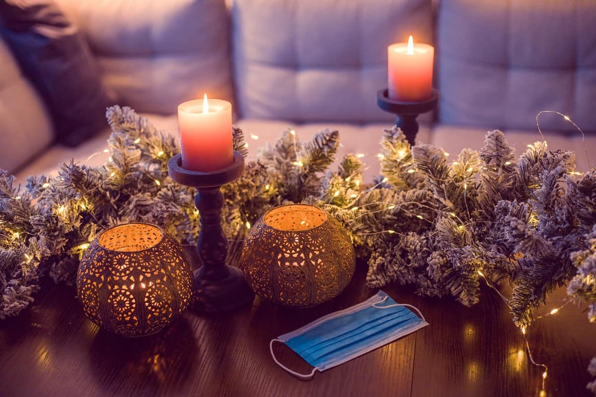 a medical mask on a table with holiday decorations