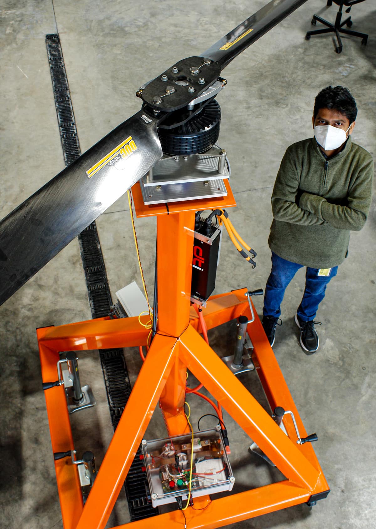 Electrical Engineer Rishikesh Bagwe with VerdeGo Aero's innovative Rotor Test Stand. 