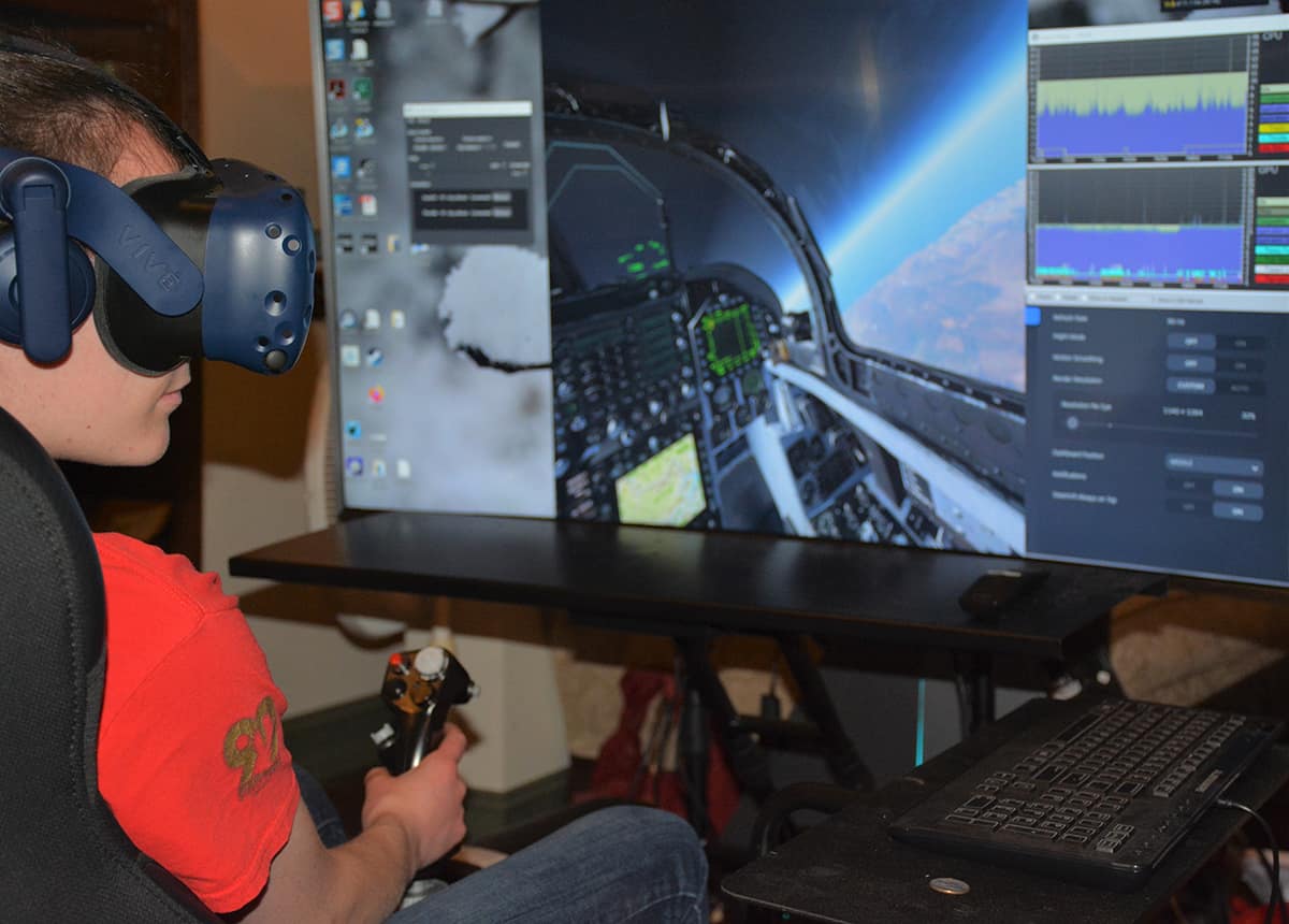Jayla Thirtyacre, a senior in the Prescott Campus Cyber Intelligence and Security program, with a Math and a Computer Science minor, tests the controls in Embry-Riddle’s new virtual reality flight simulator.