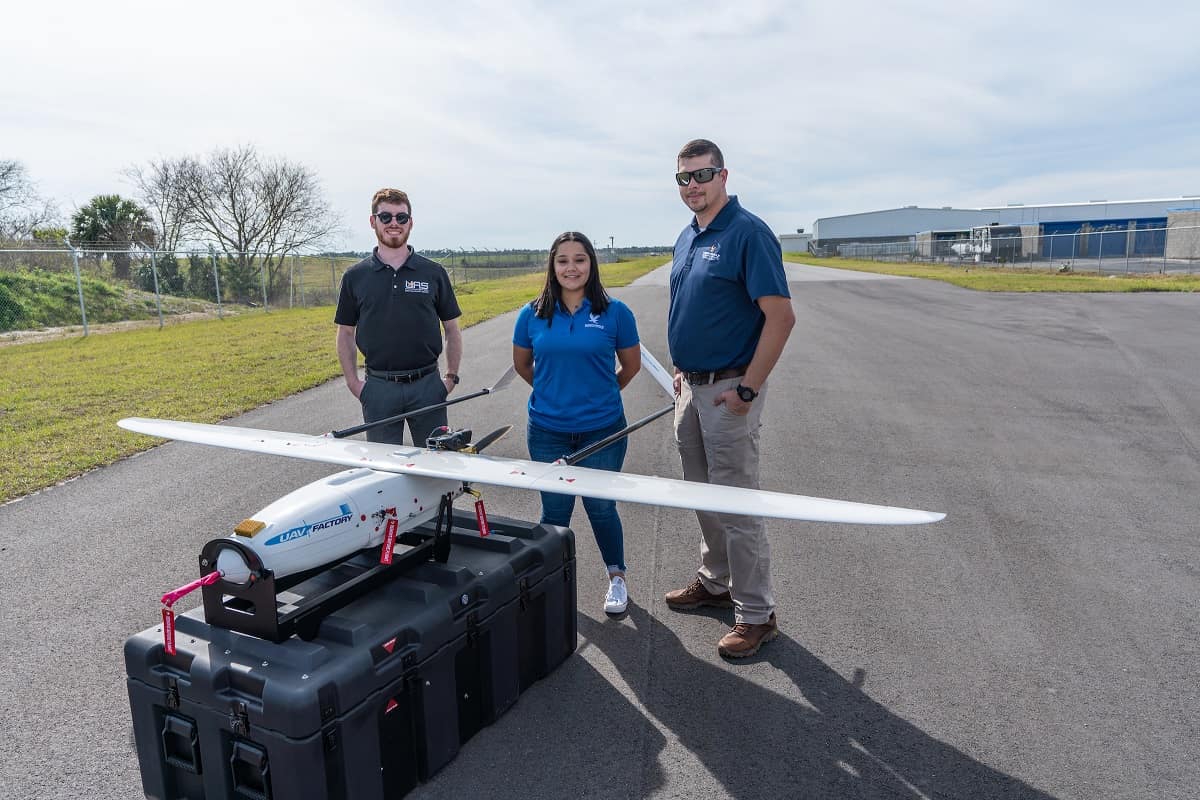 Samantha Villagran poses with a Penguin C aircraft at Embry-Riddle.