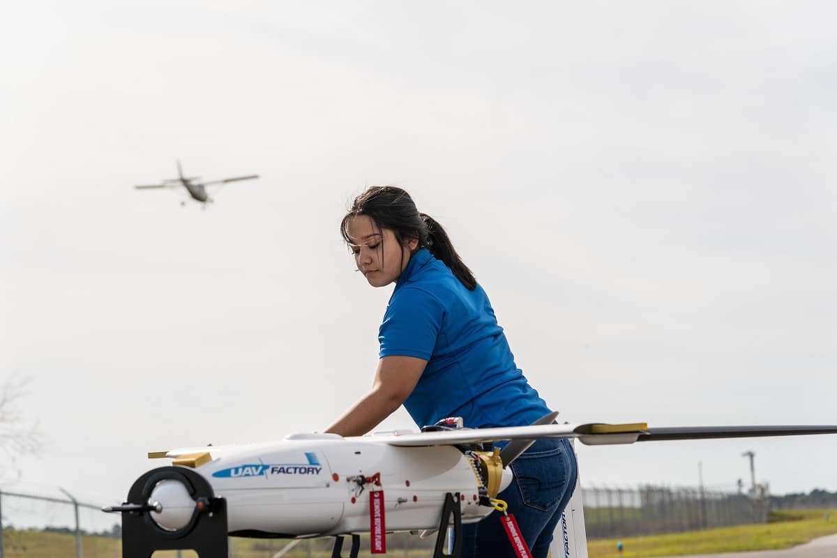 Samantha Villagran poses with a Penguin C aircraft at Embry-Riddle. (Photo: Embry-Riddle/Daryl LaBello)