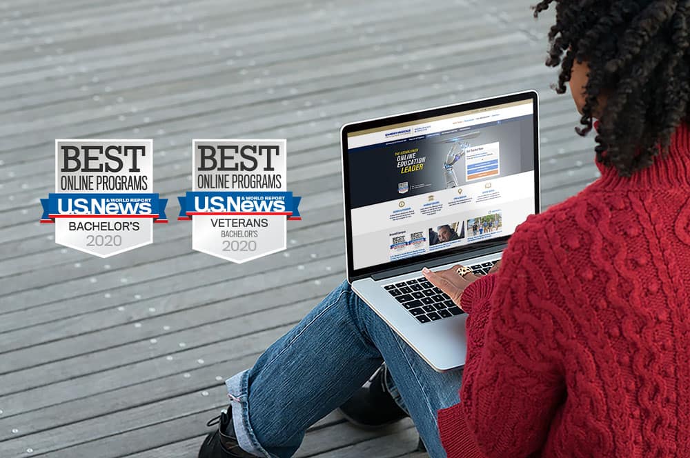 Black woman works on a laptop computer