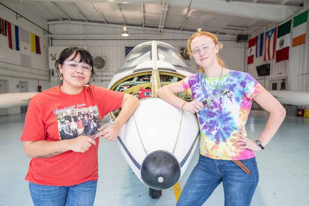 Aviation Maintenance Science students Roxanne Rosado and Sarah Fairchild work on the Lear Jet at Embry-Riddle’s Daytona Beach Campus in 2019. (Photo: Embry-Riddle/David Massey)