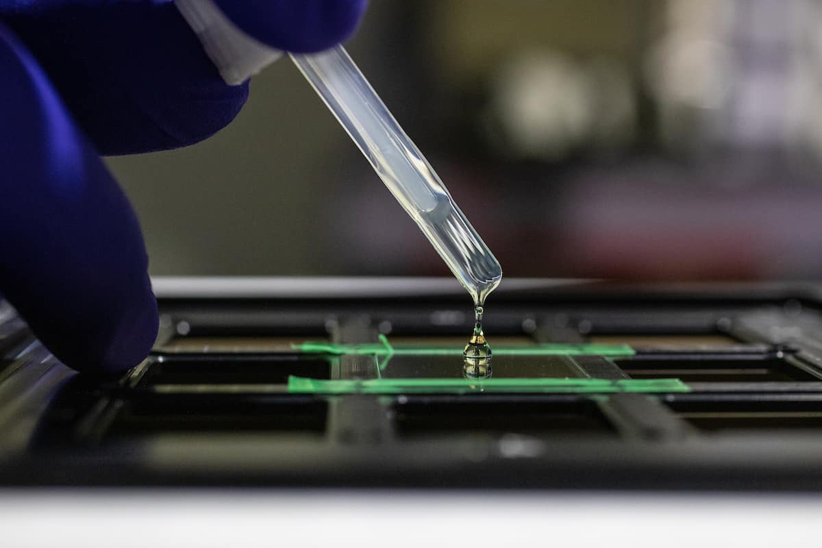 Aerospace Engineering Ph.D. students Taylor Stark and Stanislav Sikulskyi use Embry-Riddle’s new nanoscale 3D printer in the Structures Laboratory at the MicaPlex with Associate Professor Daewon Kim. The new equipment, funded by a National Science Foundation grant, will enable Embry-Riddle researchers to fabricate nano to microsize materials and structures with smart actuation and sensing, optimize metamaterial structures and polymer curing, and fabricate micromechanical and microfluidic devices to study biochemical processes and cancer. (Photos: Embry-Riddle/David Massey)