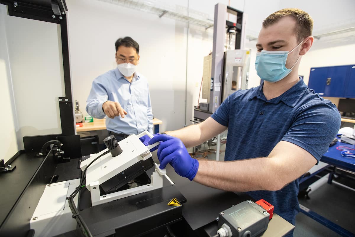 Aerospace Engineering Ph.D. students Taylor Stark and Stanislav Sikulskyi use Embry-Riddle’s new nanoscale 3D printer in the Structures Laboratory at the MicaPlex with Associate Professor Daewon Kim. The new equipment, funded by a National Science Foundation grant, will enable Embry-Riddle researchers to fabricate nano to microsize materials and structures with smart actuation and sensing, optimize metamaterial structures and polymer curing, and fabricate micromechanical and microfluidic devices to study biochemical processes and cancer. (Photos: Embry-Riddle/David Massey)