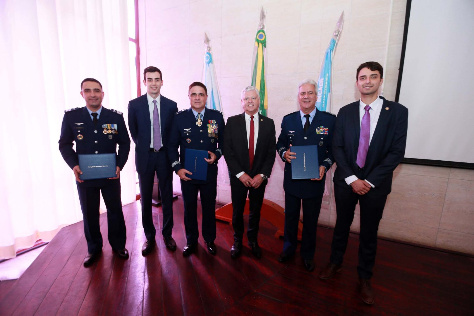 From Left to right: General Camilo, Mr. Fabio Campos, General Sergio Bastos, Dr. John Watret, General Domingues, and Mr. Israel Treptow. Representatives from DECEA and Embry-Riddle Worldwide. (Pre-pandemic photo)