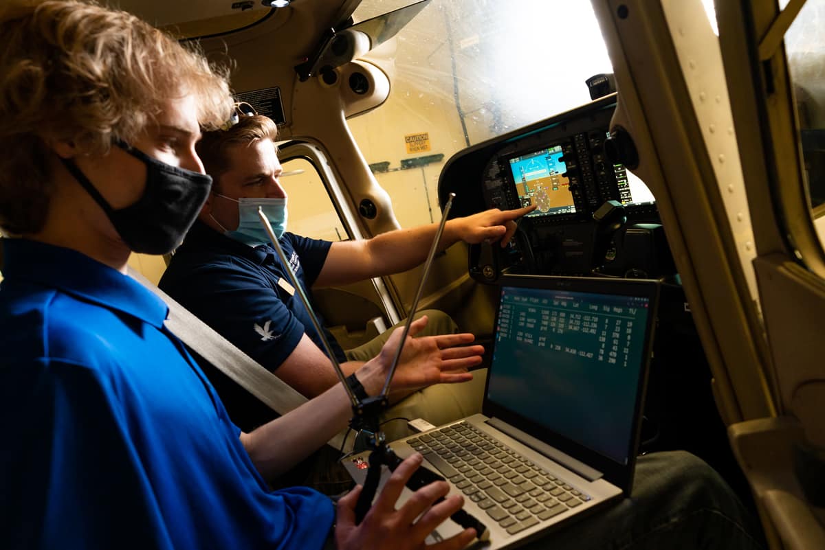 Students Brandon Nepute and Michael Ledermann test new drone-awareness software in the flight deck.
