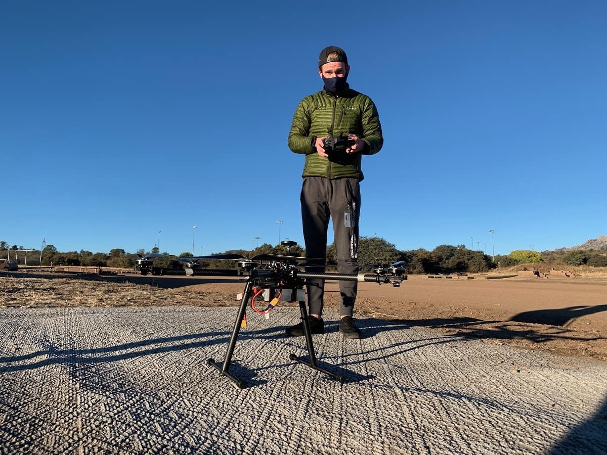 Matthew Robinaugh, a senior in aerospace engineering, confirms the rotation direction of the motors and syncs the transmitter on a drone. (Photo: Brooklyn Cross)