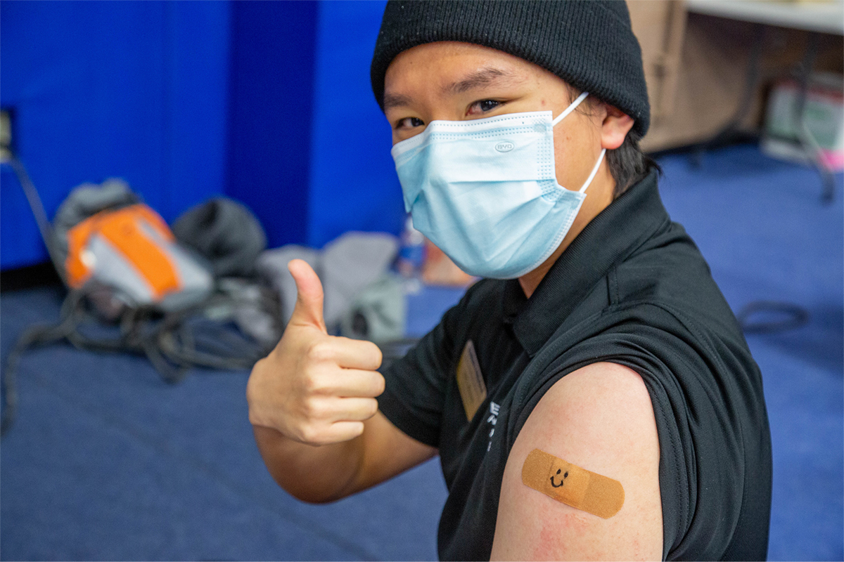 Sky Ahn, a flight instructor on Embry-Riddle’s Prescott Campus, expresses approval after receiving a first dose of Covid-19 vaccine during an on-campus clinic on March 11. Photo: Embry-Riddle / Jason Kadah