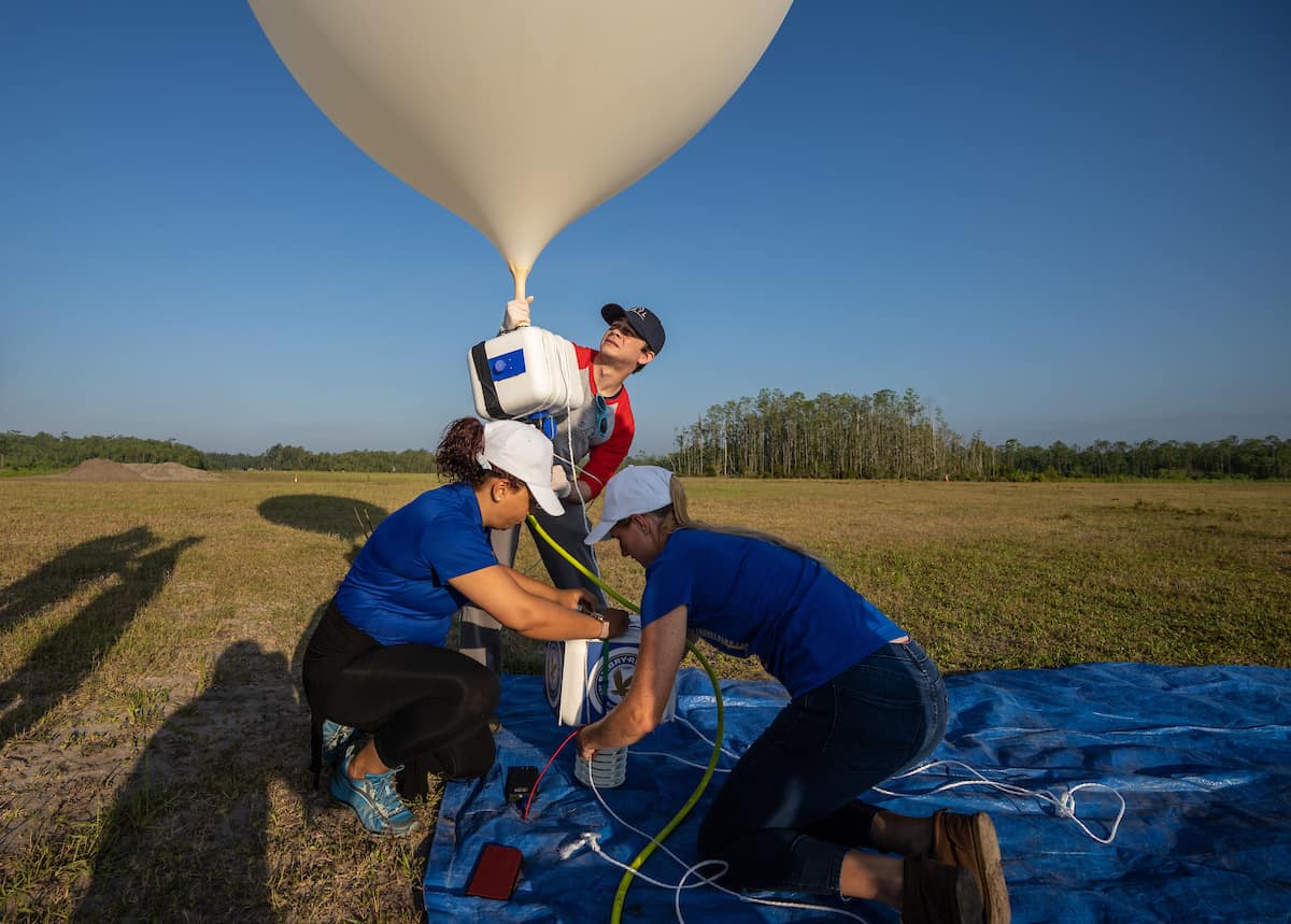 Dr. Kevin Adkins, associate professor of Aeronautical Science and director of the UNmanned Vehicle and Atmospheric Investigation Lab (UNVAIL) (at left), and College of Engineering student Avinash Muthu Krishnana prepare to fly a drone equipped with weather sensors, at Coe Field. (Embry-Riddle/David Massey)