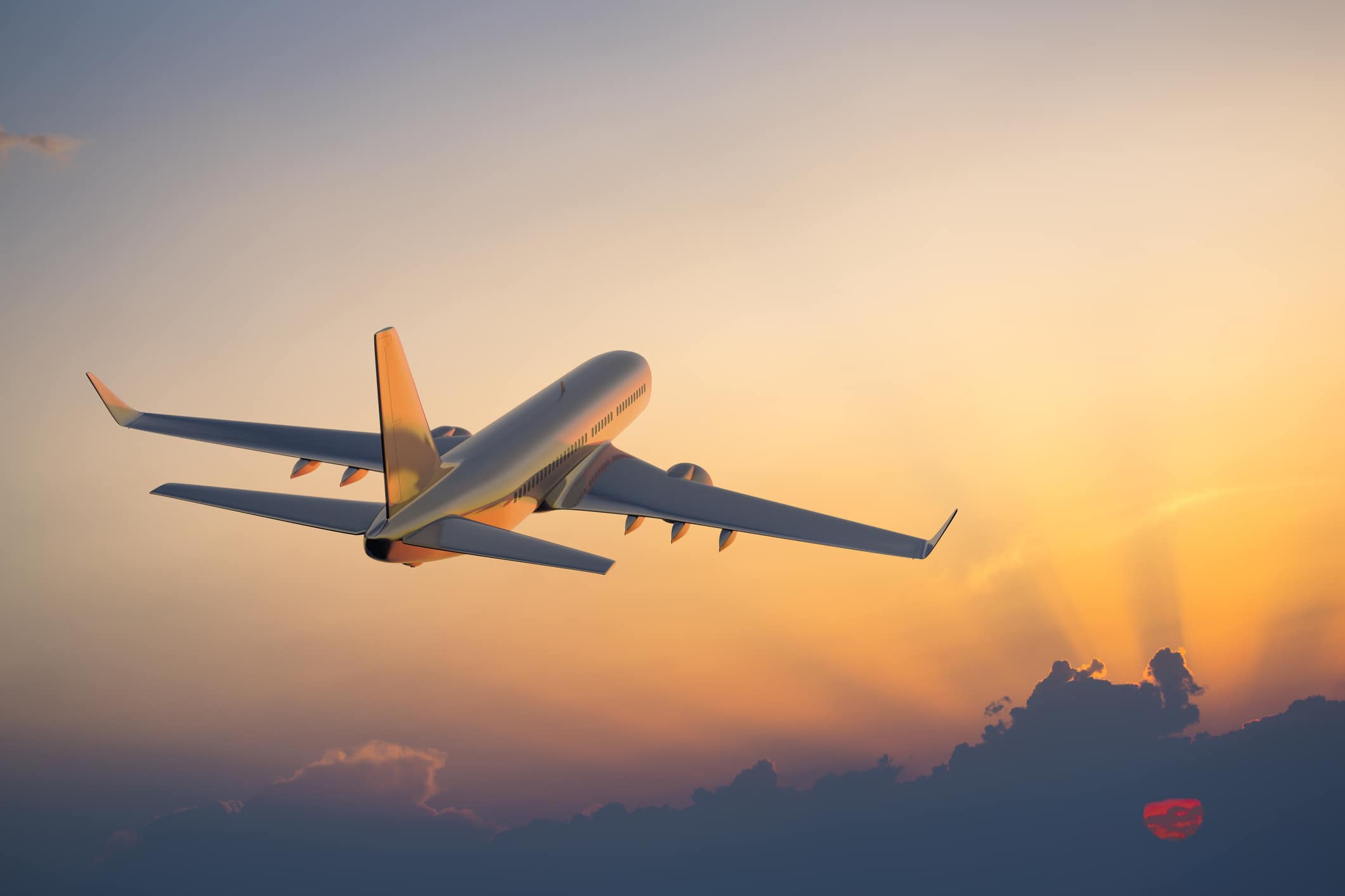 an airplane flies into the sunrise