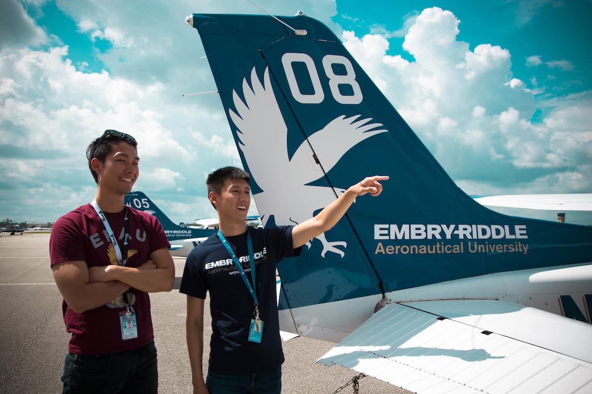 Singapore students stand by a plane