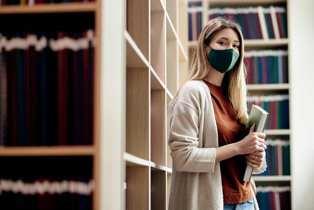 A female student wearing a mask.