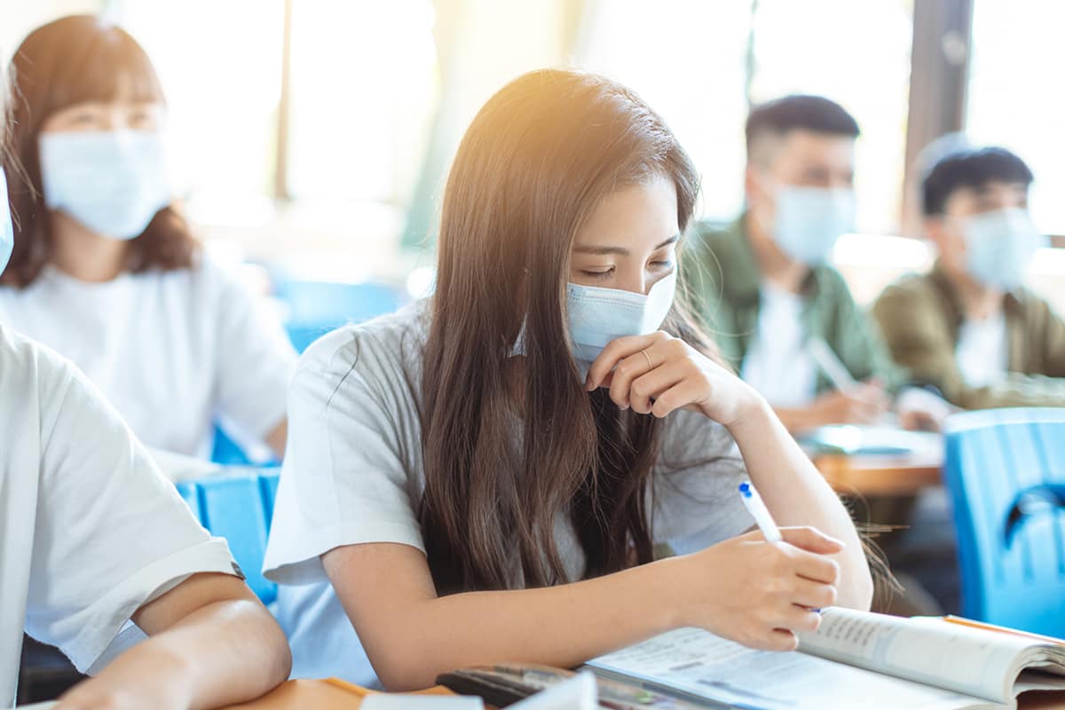 female student in class with mask on