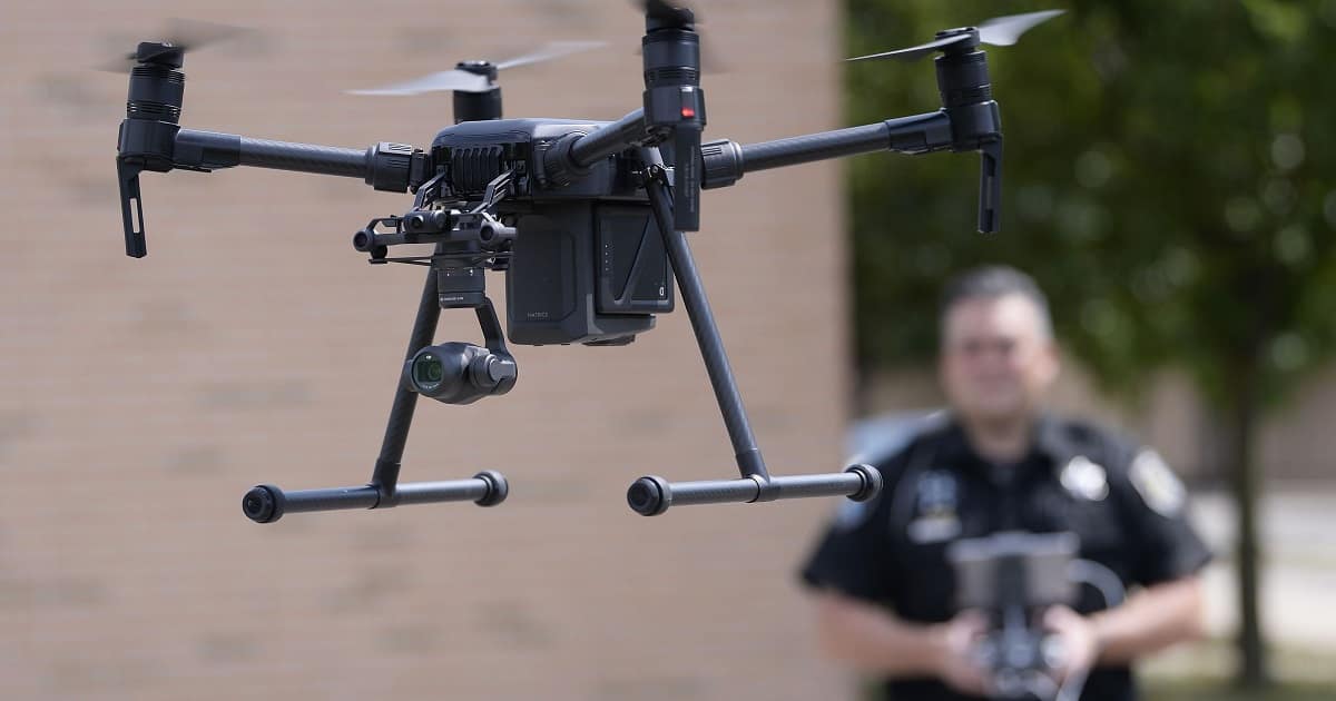 Police officer flies a drone
