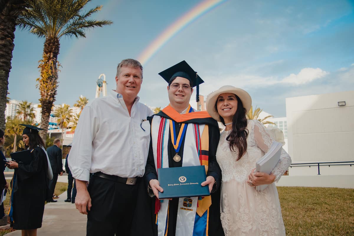 ERAU graduate with family