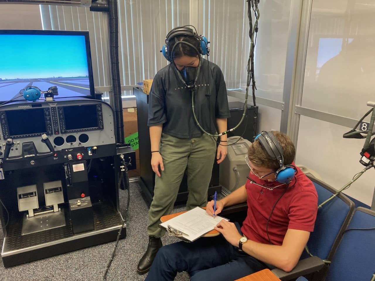 Aerospace Physiology students Olivia Siu and Nicholas Lee monitor operations in Embry-Riddle’s High-Altitude Lab (HAL). 