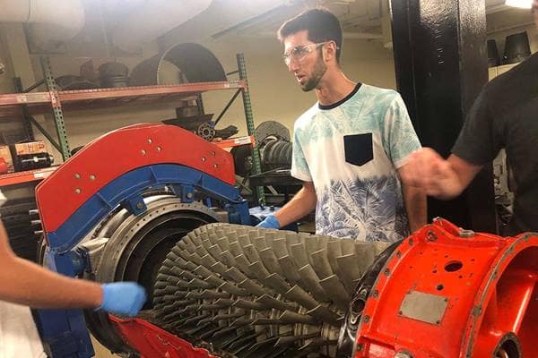 Aviation Maintenance Science (AMS) senior Mathias Berdugo works on an aircraft engine in a lab on Embry-Riddle’s Daytona Beach Campus. (Photo: Mathias Berdugo)