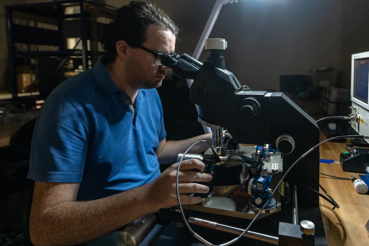 Electrical and Computer Engineering master’s student Justin Parkhurst tests connections in an unmanned system, or drone, using a multimeter, as well as uses a microscope and testing equipment to review circuitry, in Embry-Riddle’s Wireless Devices and Electromagnetics (WiDE) Laboratory, located in the Research Park. (Photos: Embry-Riddle/Daryl LaBello)