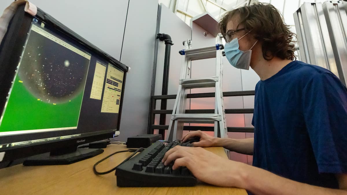 Astronomy and Astrophysics major Jonathan Hodge examines data gathered with Embry-Riddle’s one-meter research telescope.