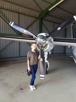 Savannah Boltman in front of an aircraft