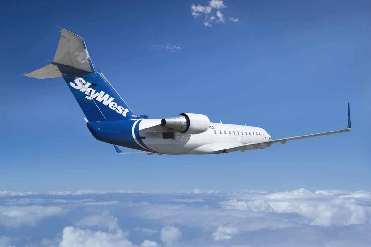 A SkyWest jet flying among the clouds