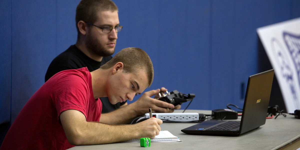 Students with UAV and laptop