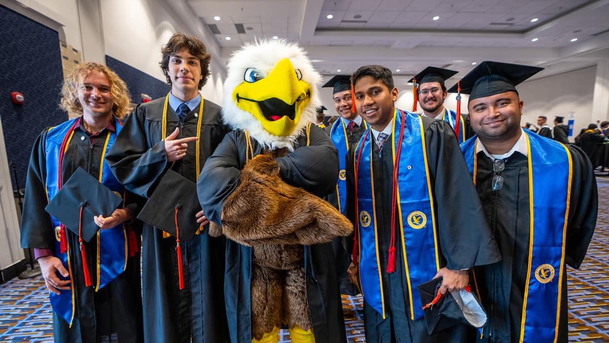 Graduates pose with ERNIE eagle